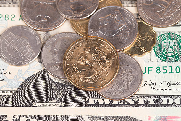 istock US coins on US banknotes close up 539184365