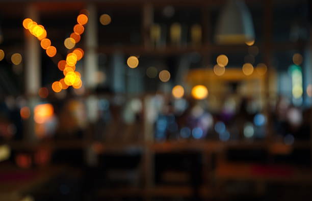 blur dark bar or cafe at night - bar stok fotoğraflar ve resimler