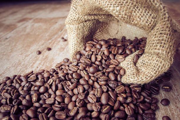 istock coffee beans in bag on wooden background 539203892