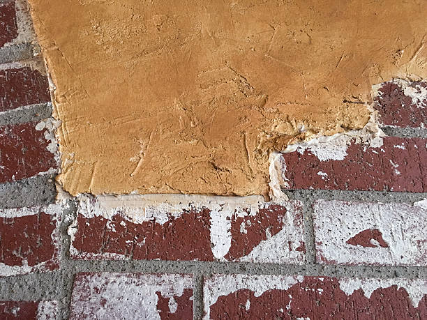 istock Close-up of brick wall with plaster 539203936