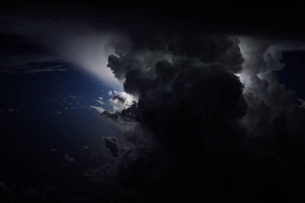 Thunderstorms over the Caribbean sea with big vertical development and lightning bolts.
