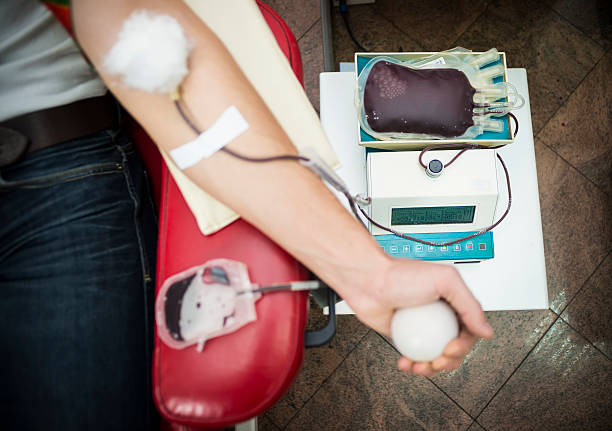 istock Close up of man hand on blood donation 539205849