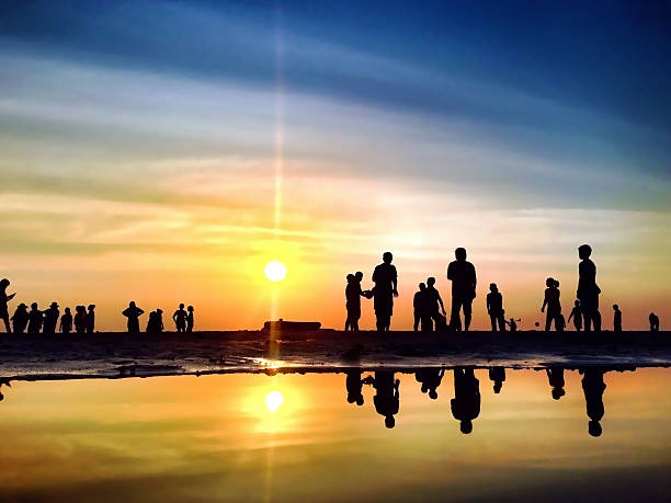 istock Silhouette Peoples on The Sunset Beach 539205995