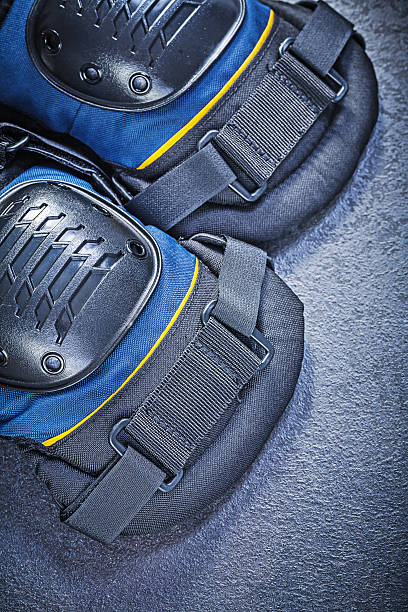 istock Knee protectors on black background top view construction concep 539206442