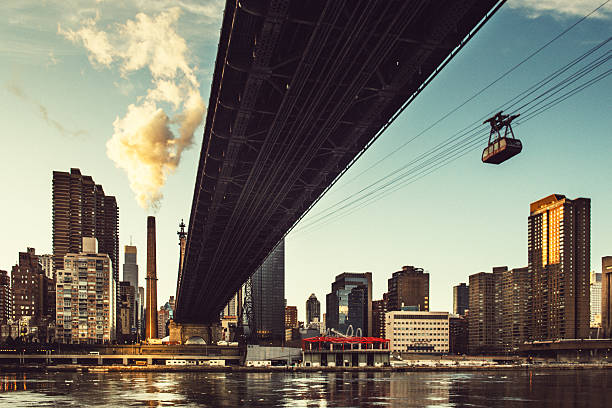 Roosevelt Island Tramway and Queensboro Bridge New York View of Roosevelt Island Tramway and Queensboro bridge in New York City roosevelt island stock pictures, royalty-free photos & images