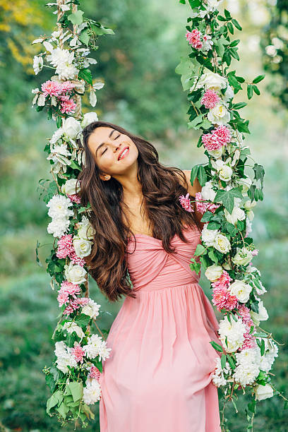 istock Beautiful young girl on a swing 539206695