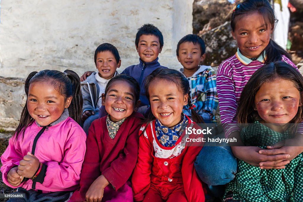 Group happy Sherpa children in Everest Region Sherpa are an ethnic group from Khumbu - the most mountainous region of Nepal, high in the Himalayas. Many of them live inside Mount Everest National Park - the highest national park in the world, with the entire park located above 3,000 m ( 9,700 ft). This park includes three peaks higher than 8,000 m, including Mt Everest. Therefore, most of the park area is very rugged and steep, with its terrain cut by deep rivers and glaciers. Unlike other parks in the plain areas, this park can be divided into four climate zones because of the rising altitude. Nepal Stock Photo