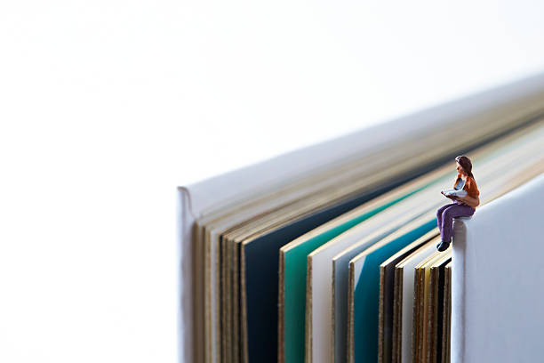 istock Book with miniature woman 539206870