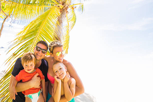 istock Smiling family at the beach 539207007