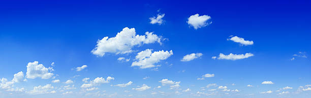 Cloudscape - White clouds in the blue sky stock photo