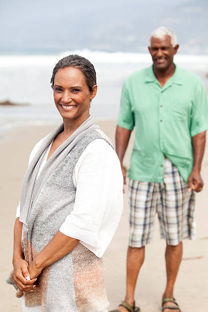 istock African American Seniors Smiling Together on Beach 539208425