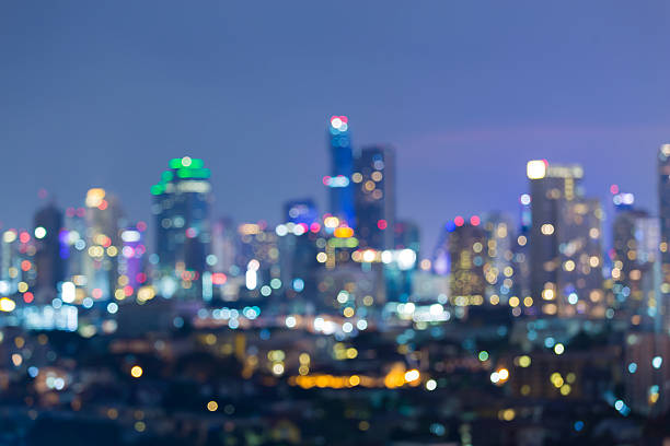 istock Abstract blurred lights background, office building with twilight sky background 539208812