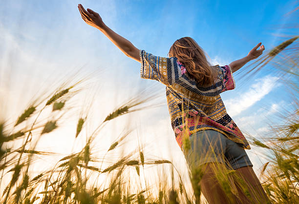 istock Beautiful girl on the field in sun light. 539211052