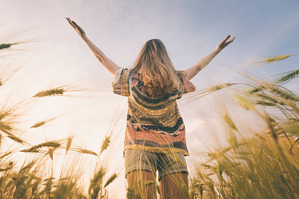 istock Beautiful girl on the field in sun light. 539211108