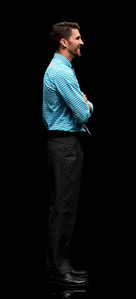 istock Smiling businessman standing with arms crossed 539211784