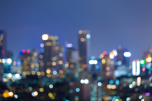istock Blurred light city and office building night view, abstract background 539212894