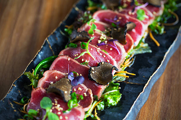 Beef tataki Marinated beef in teriyaki sauce with tartufo and sesame fusion food stock pictures, royalty-free photos & images