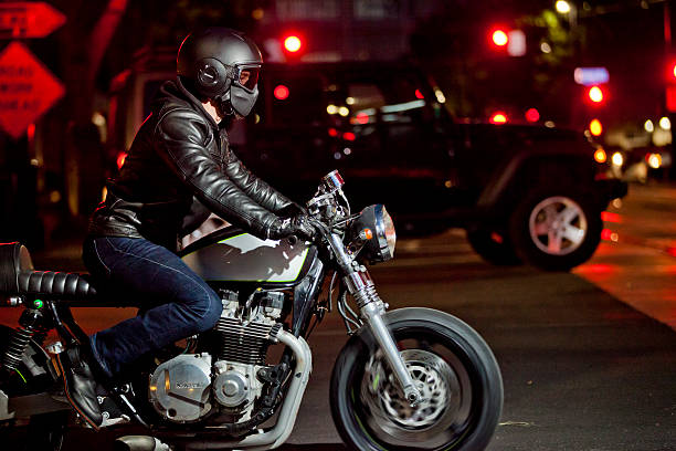 a man riding a motorbike along a scenic road