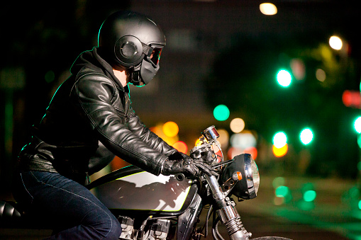 Motorcyclist passing cars in a traffic jam in the Colombian capital in the afternoon. Bogota. Colombia . July 18, 2023.