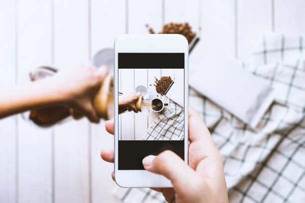 istock Hand taking photo of poured coffee 539216480