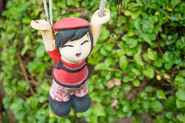 istock Hanging Chinese doll in garden 539217338