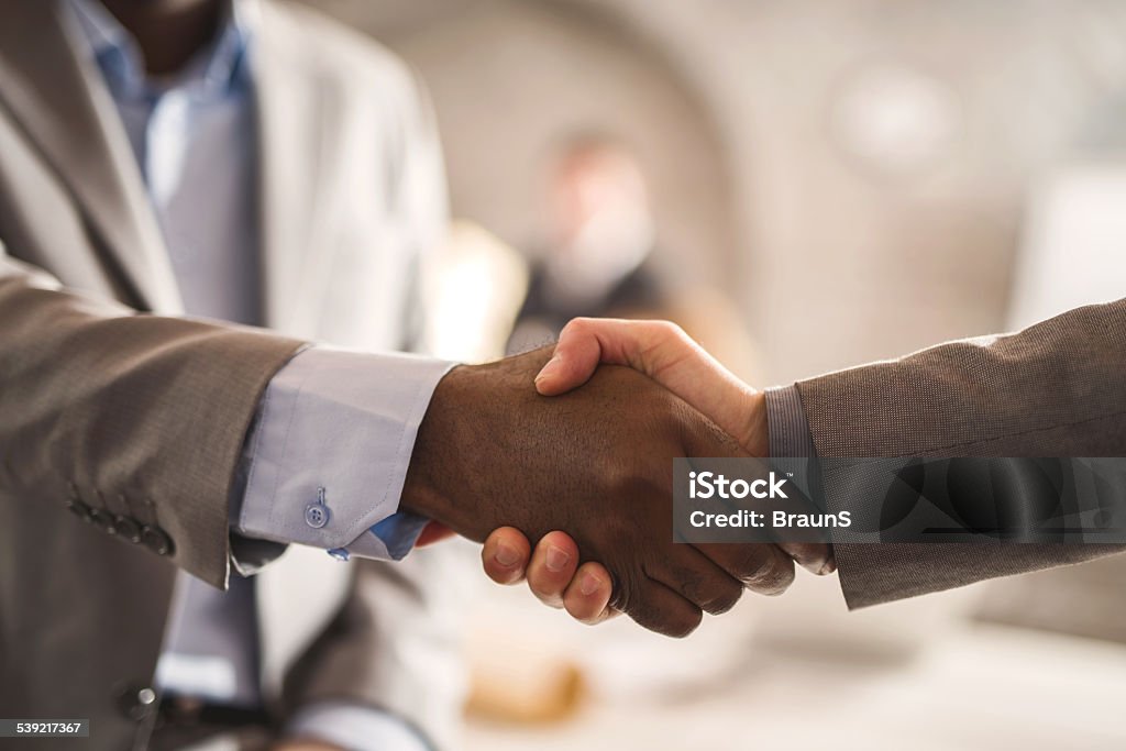 Business handshake. Unrecognizable business people shaking hands. Handshake Stock Photo