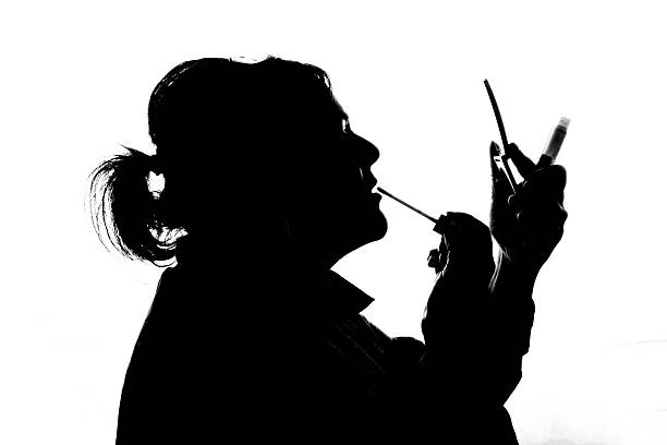 istock Mature woman putting on makeup 539217440