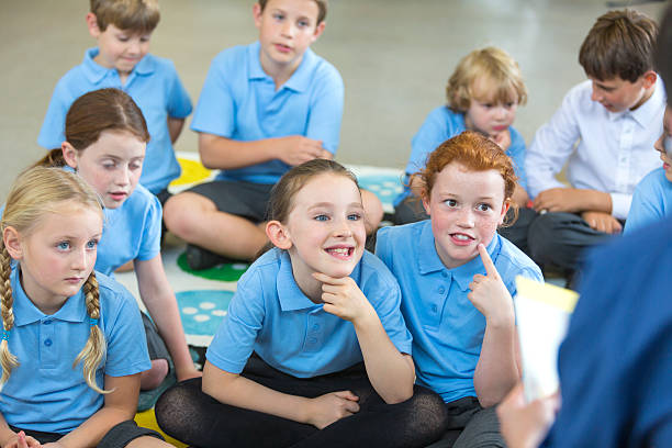 istock Students Listen To Teacher Reading to Class 539217529