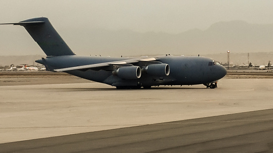 Modern air force transport airplane on the ground side view