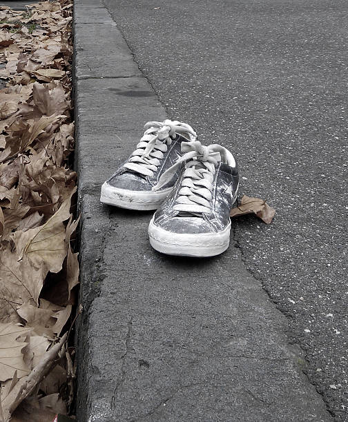 istock Abandoned shoes on the pavement 539220632
