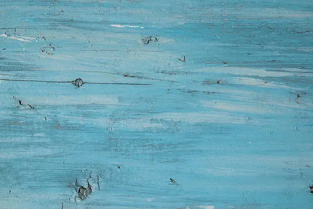 Photo of Blue paint on a wooden board use for background