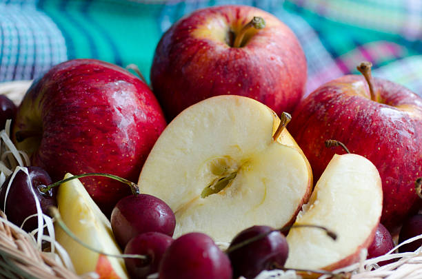 istock Red apples and cherry on a towel 539225390
