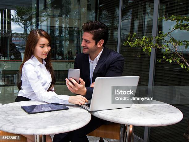 Multiracial Business Team Working Outdoors Stock Photo - Download Image Now - Adult, Adults Only, Agreement