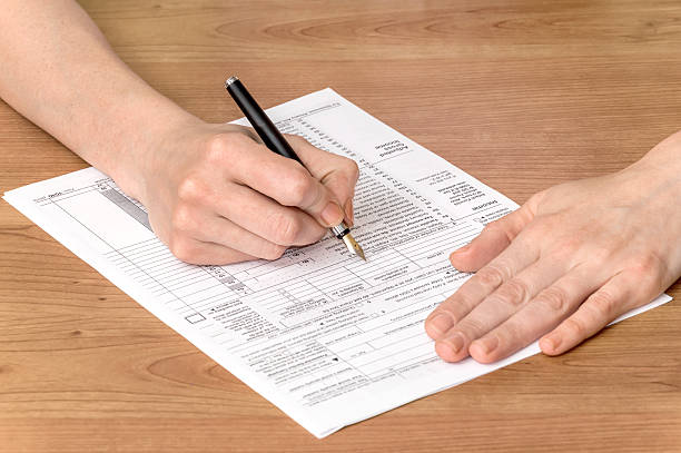 istock Woman fills the documents 539229716