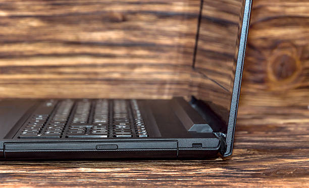 istock Laptop on wooden background 539230412