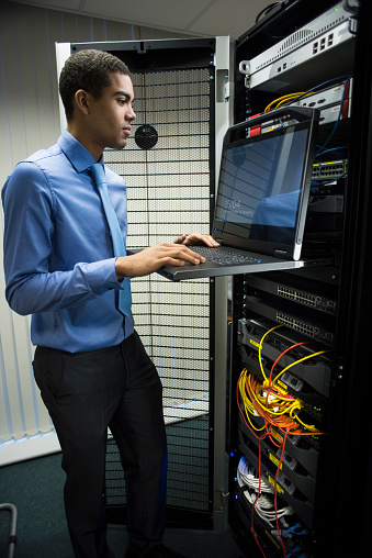 IT trainee in server room