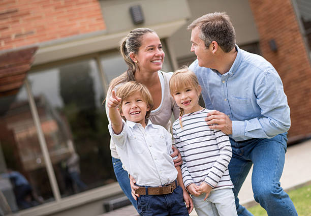 istock Happy family outside their house 539233183