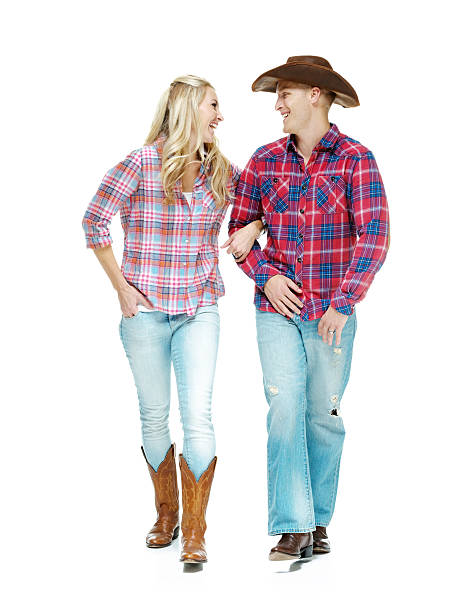 istock Happy cowboy couple walking together 539233248