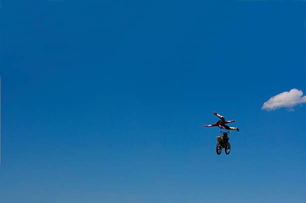 Salvador, Bahia, Brazil - May 31, 2019: Young native, in silhouette, is jumping from the Porto da Barra pier in the city of Salvador, Bahia.
