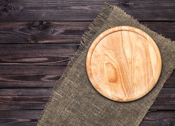 istock Chopping board on wooden table, top view 539233426
