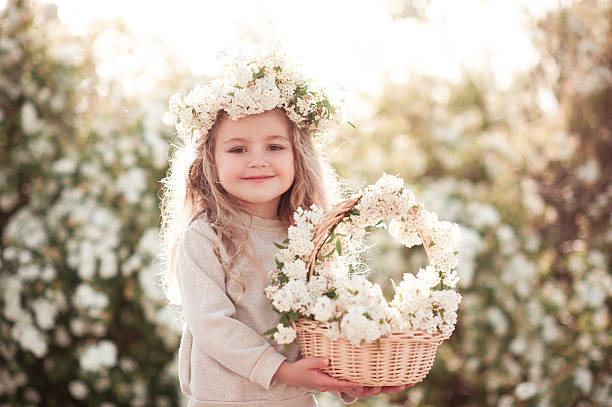 istock Happy girl holding flowers 539233672