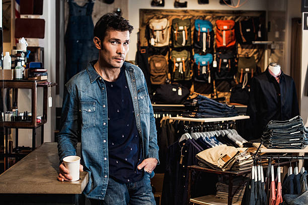 istock Man in drinking coffee inside a fashion store 539233783