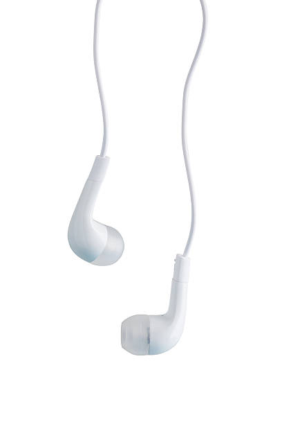 earphones suspended in empty space stock photo