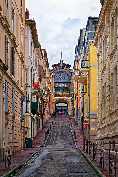 Street near the spring in Evian-les-Bains in France Street and the spring in Evian-les-Bains in France in winter in the New Year evian les bains stock pictures, royalty-free photos & images