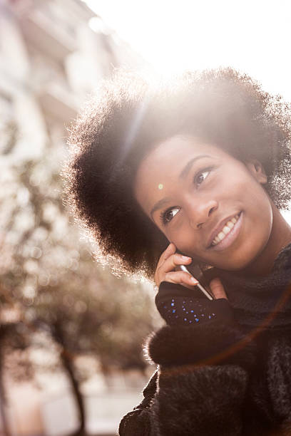 istock Woman walking and talking on the phone in downtown 539234977