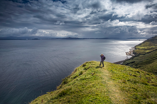 Woman photographing in Isle of Skye,Scotland.