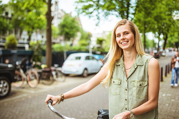 istock Dutch woman with bicycle in amsterdam 539235739