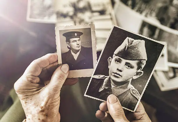 Photo of Senior woman with dear photographs of her husband