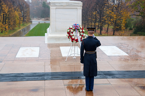 Arlington, USA - November 16, 2011: Soldier salutes - changing the guard in the afternoon at the grave of the unknown soldier at the cemetery of Arlington in Washington, USA