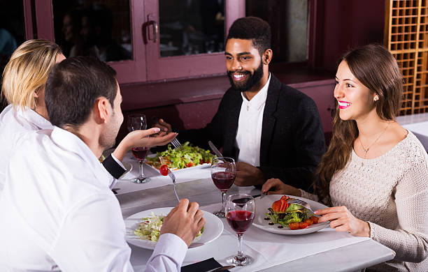 istock middle class people enjoying food in cafe and talking 539236726